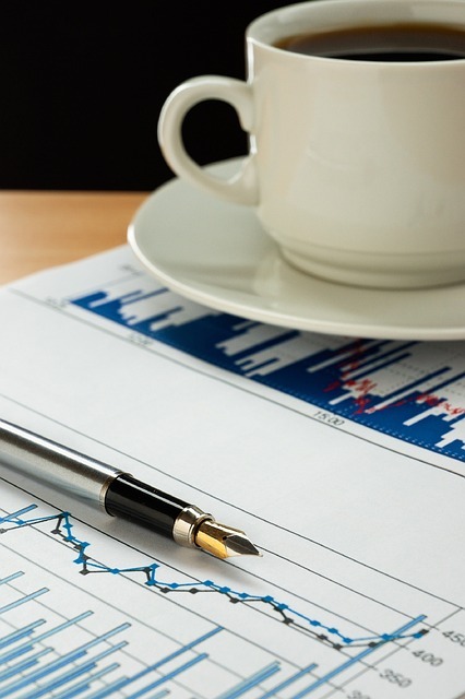 the impact of Foreign Direct Investments (FDI) on the economic growth of developing countries, accompanied by a pen and a coffee cup